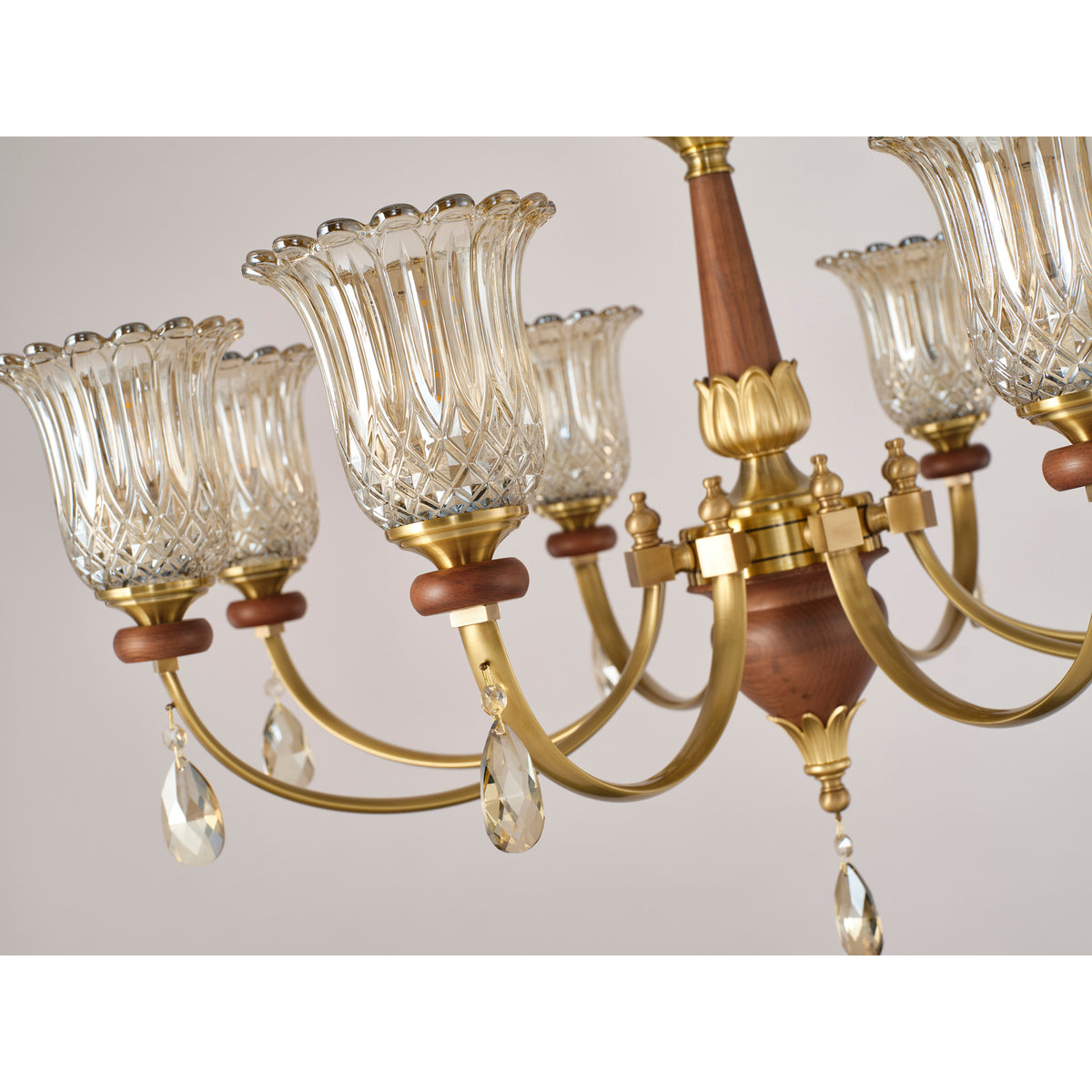 Supplier real chandelier detail showing the looping arm and crystal accent
