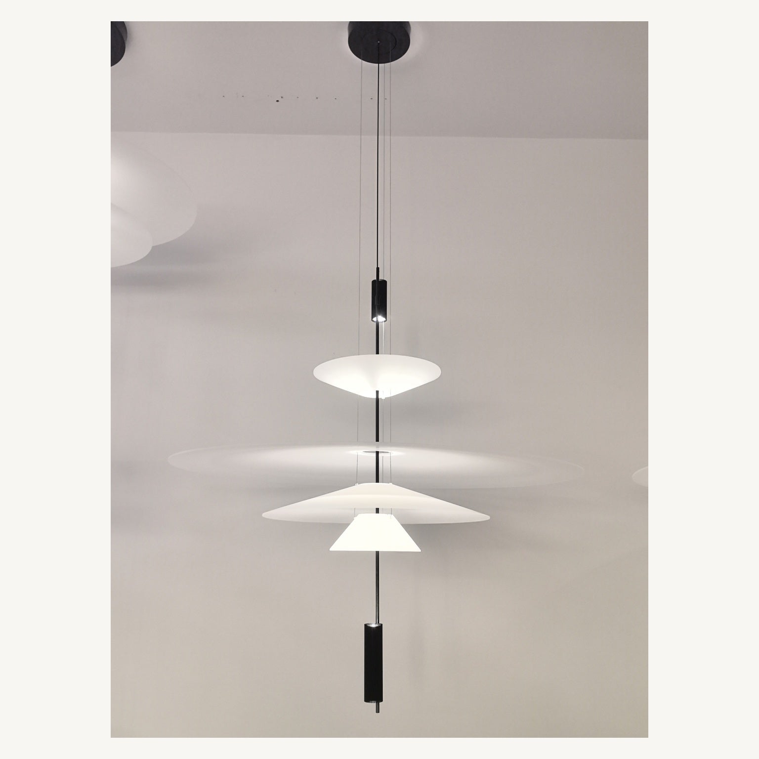 Supplier real photograph of the complete four-tier layered acrylic disc pendant with canopy