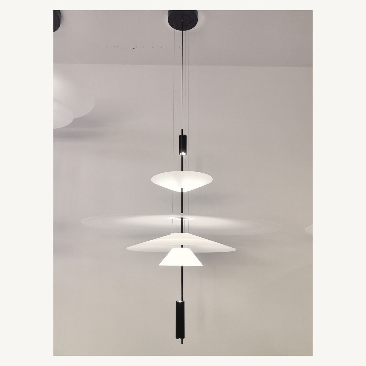 Supplier real photograph of the complete four-tier layered acrylic disc pendant with canopy
