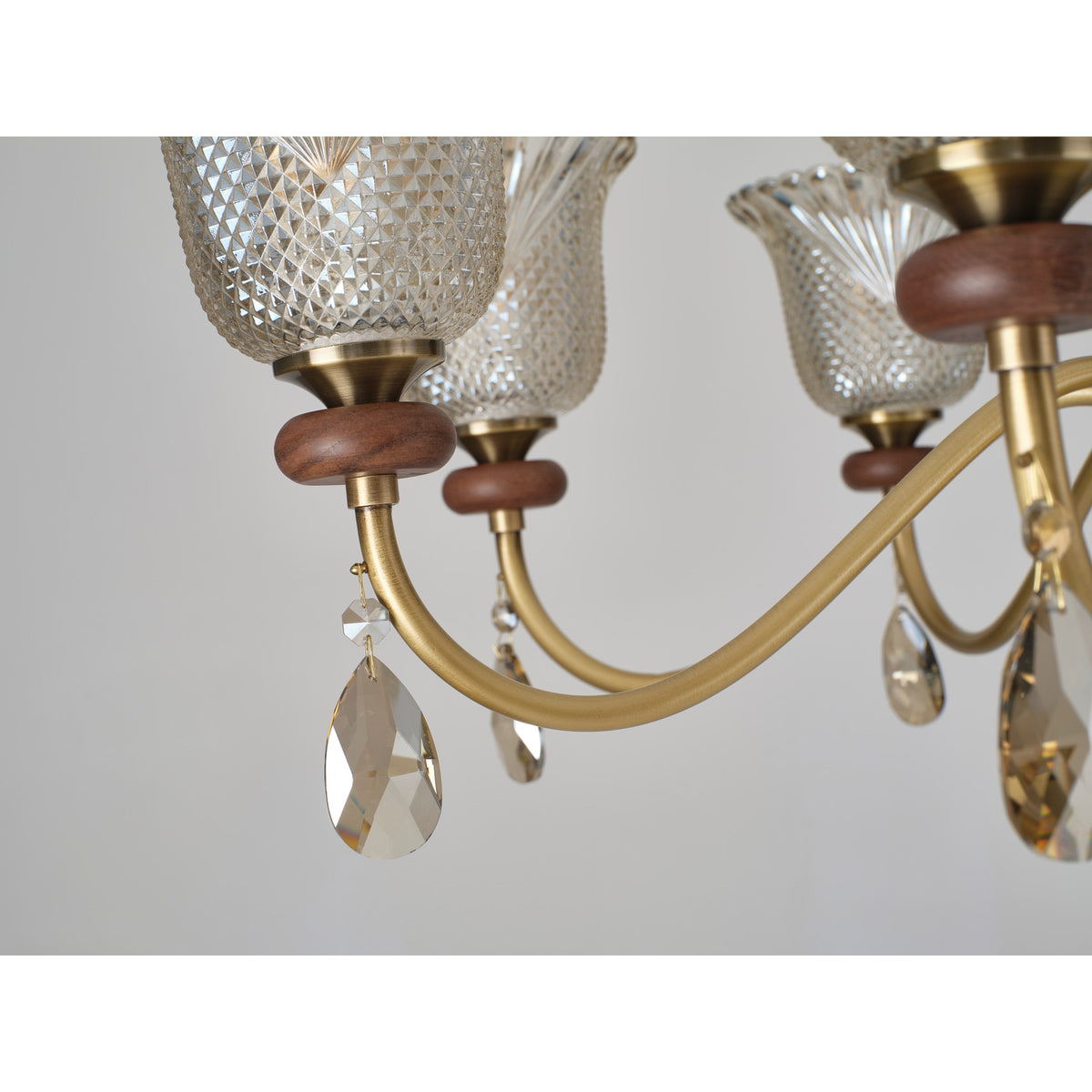 Cognelle chandelier curved copper arm and crystal detail