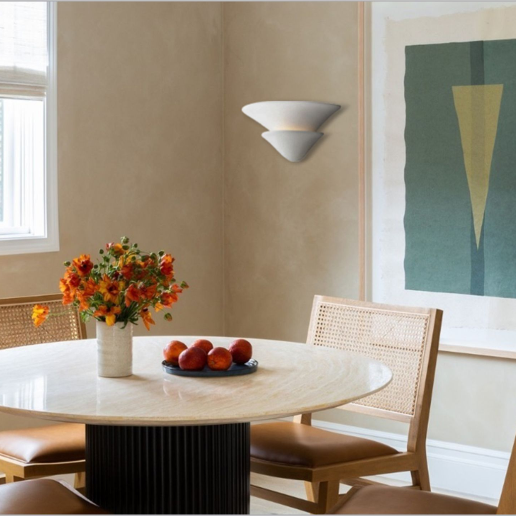 Sculptural Double-Tier Plaster Wall Sconce — complete real wall sconce in a dining interior