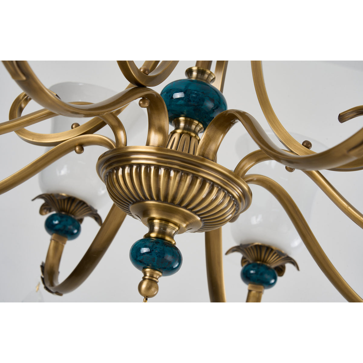 Real Marcelline chandelier detail showing the ribbed central bowl and teal accent
