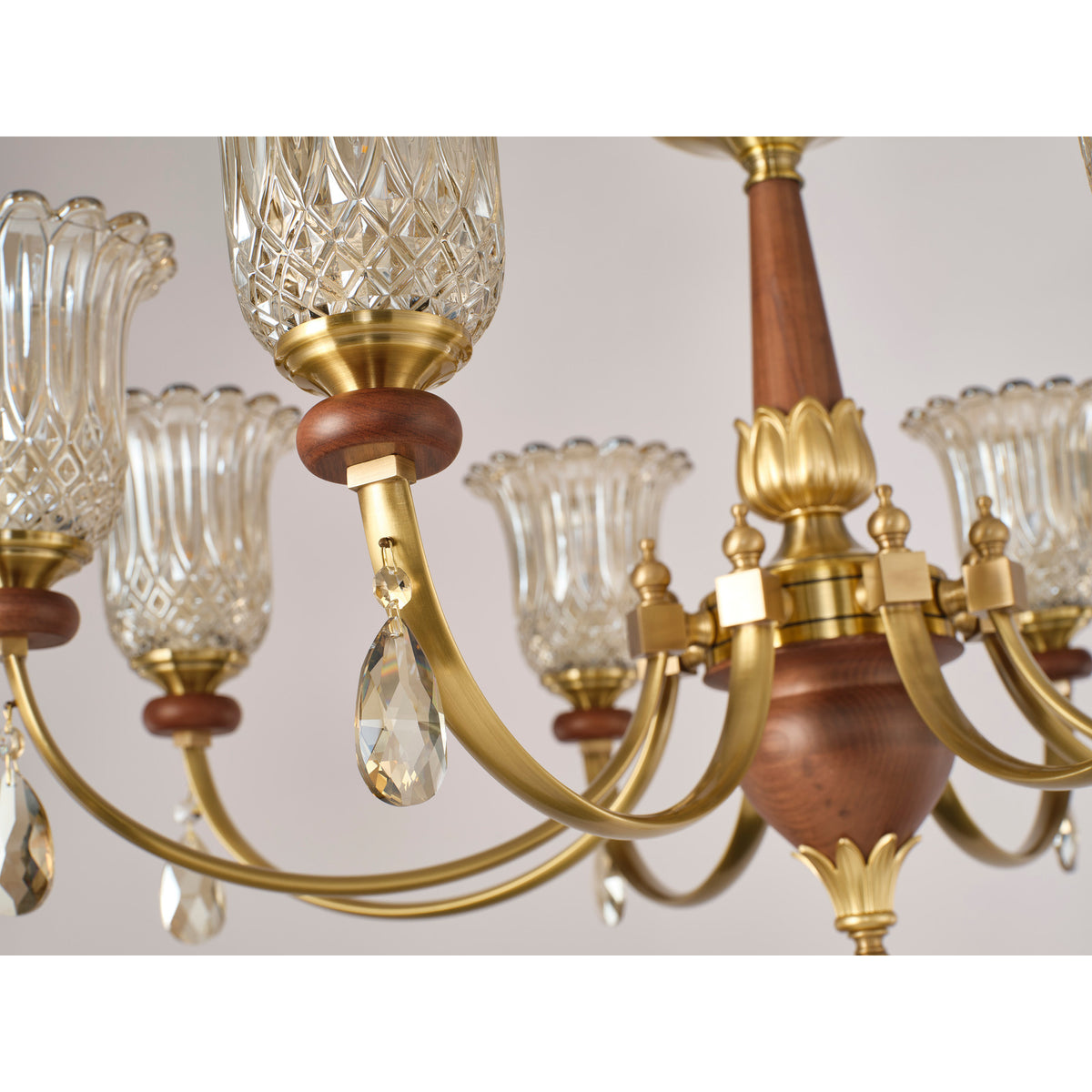 Supplier real chandelier detail showing the diamond-cut glass band and center hub