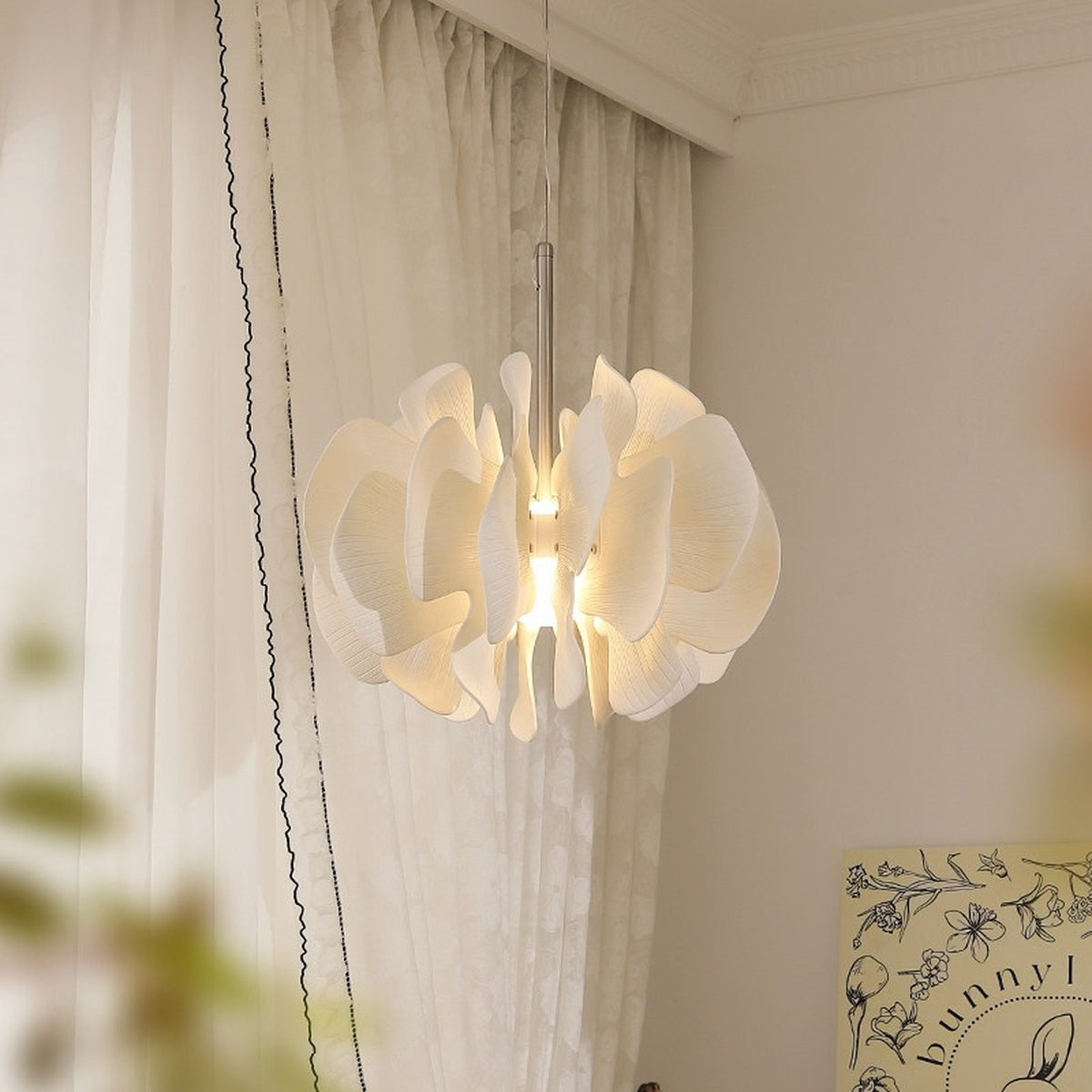 Sculptural Ivory Ceramic Petal Pendant real product view lit from the front