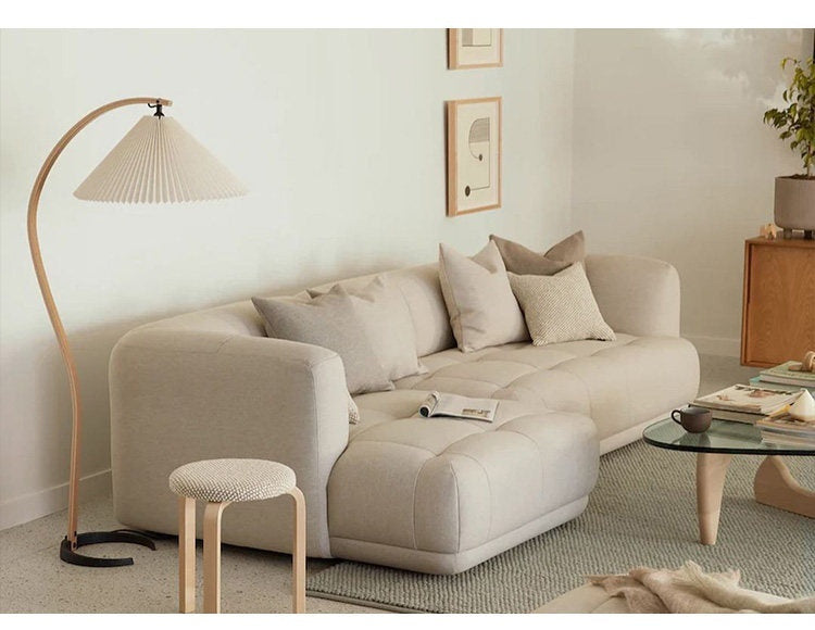 Sculptural Wood Floor Lamp — complete real floor lamp beside a sofa