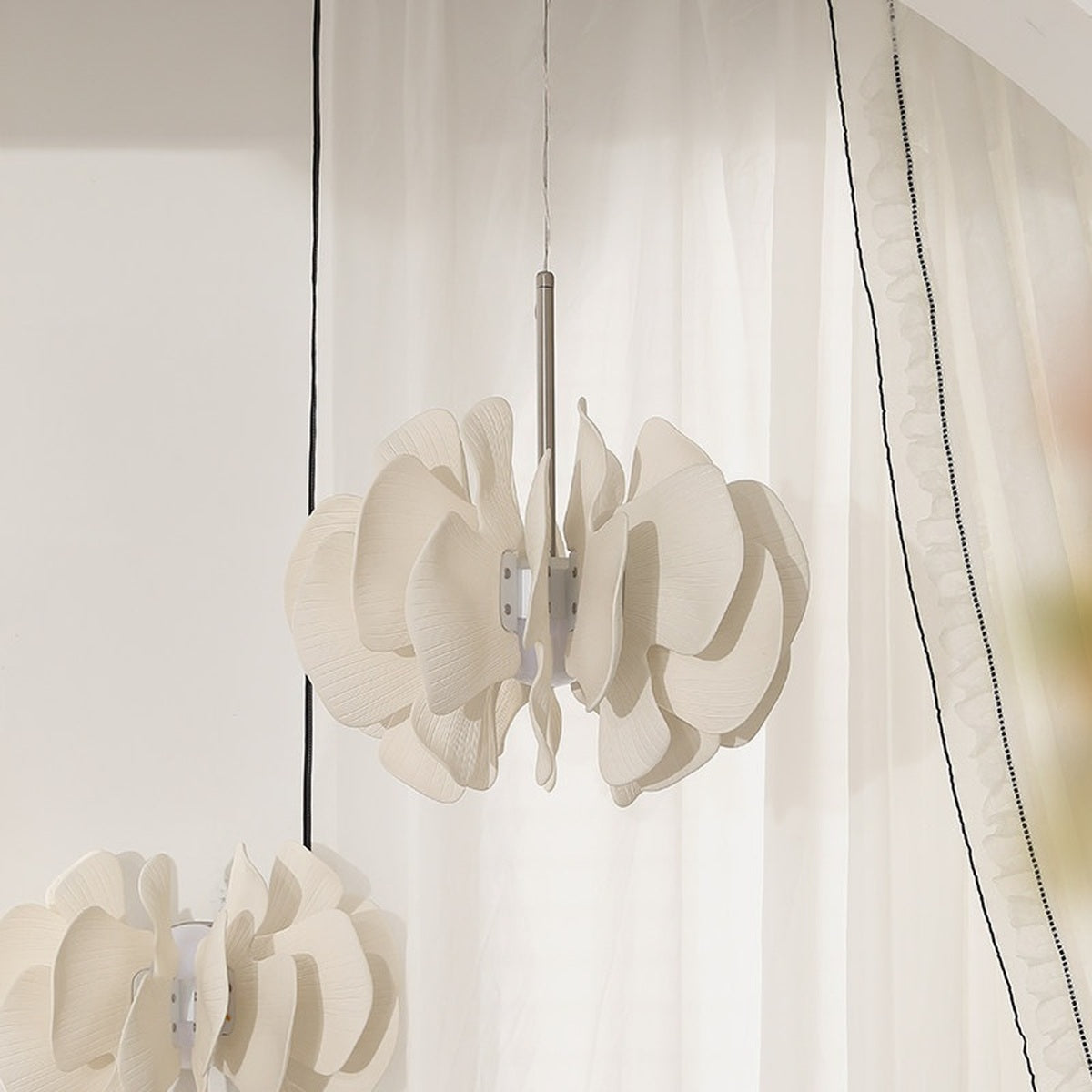 Sculptural Ivory Ceramic Petal Pendant real product side view with the light off