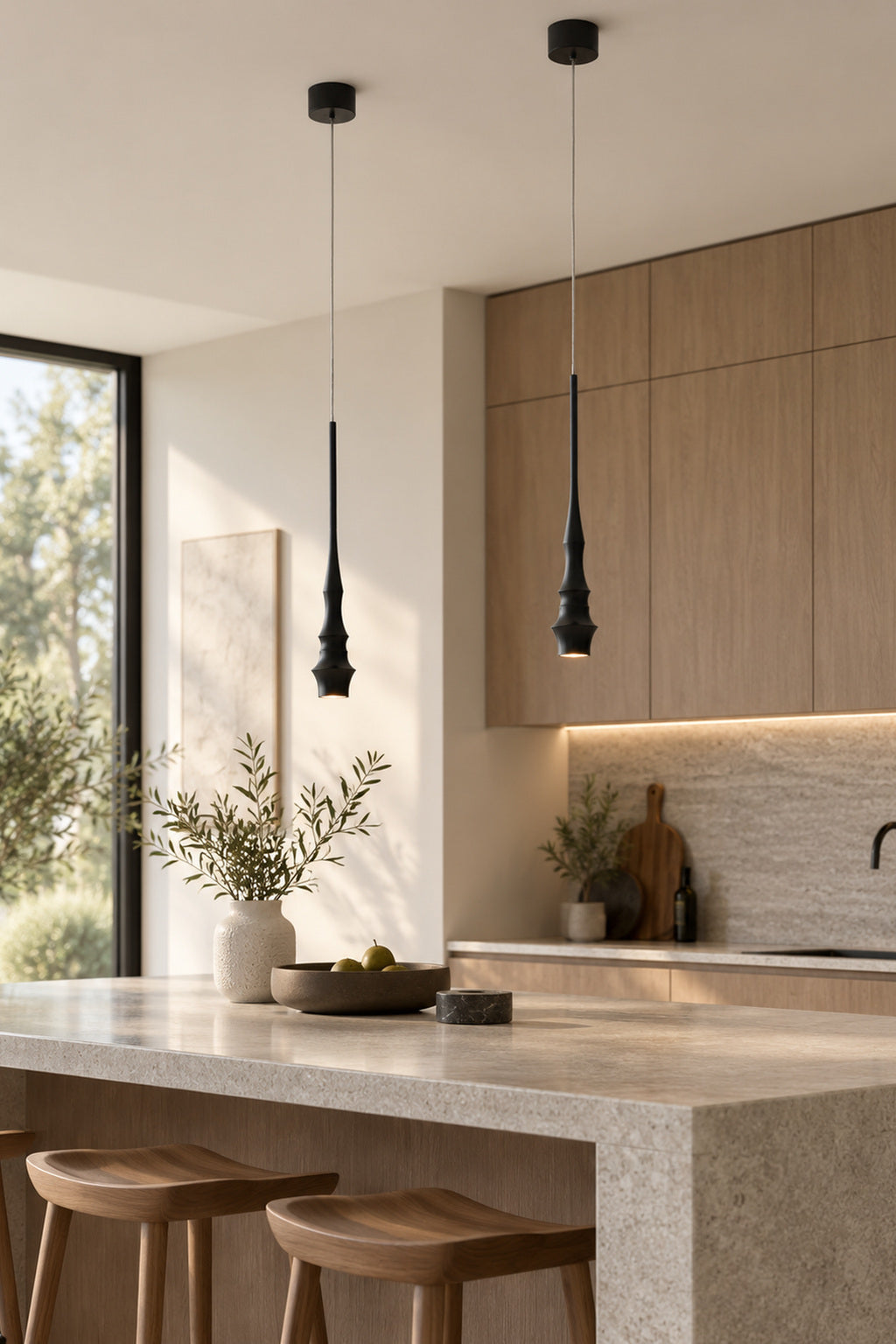 Torvelle Sculptural Pendant Light in black above a modern kitchen island · CDE 2026-09-25