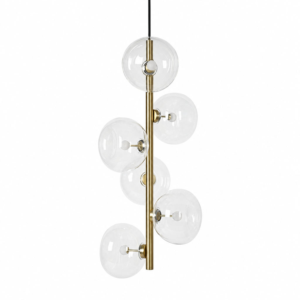 Clear glass six-light vertical pendant in Natural Brass on a white background