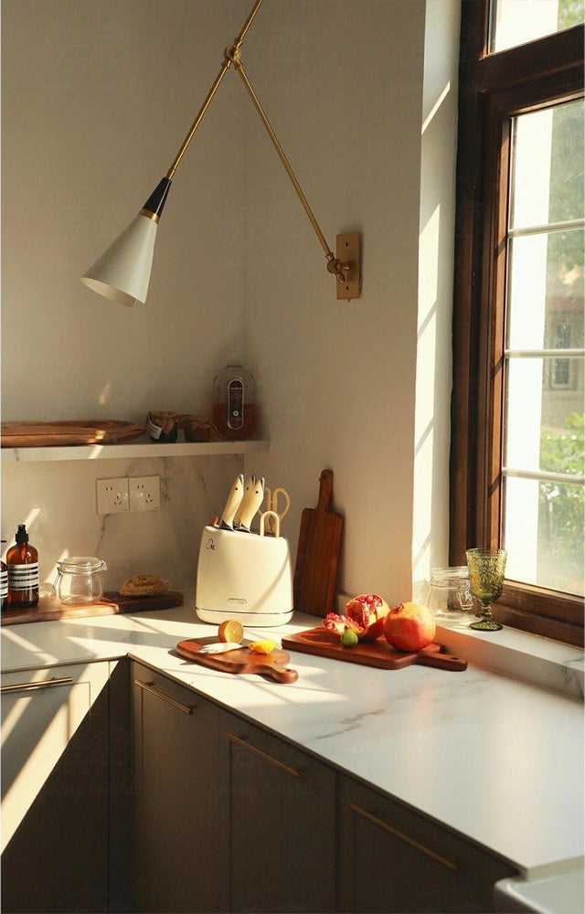 Adjustable Brass Wall Sconce — complete real Long Arm sconce by a kitchen window