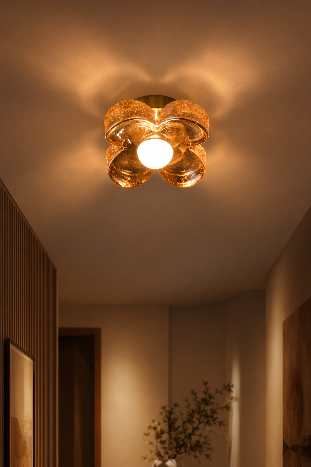 Single-Light Amber Glass Flush Mount Ceiling Light illuminated in a warm evening interior