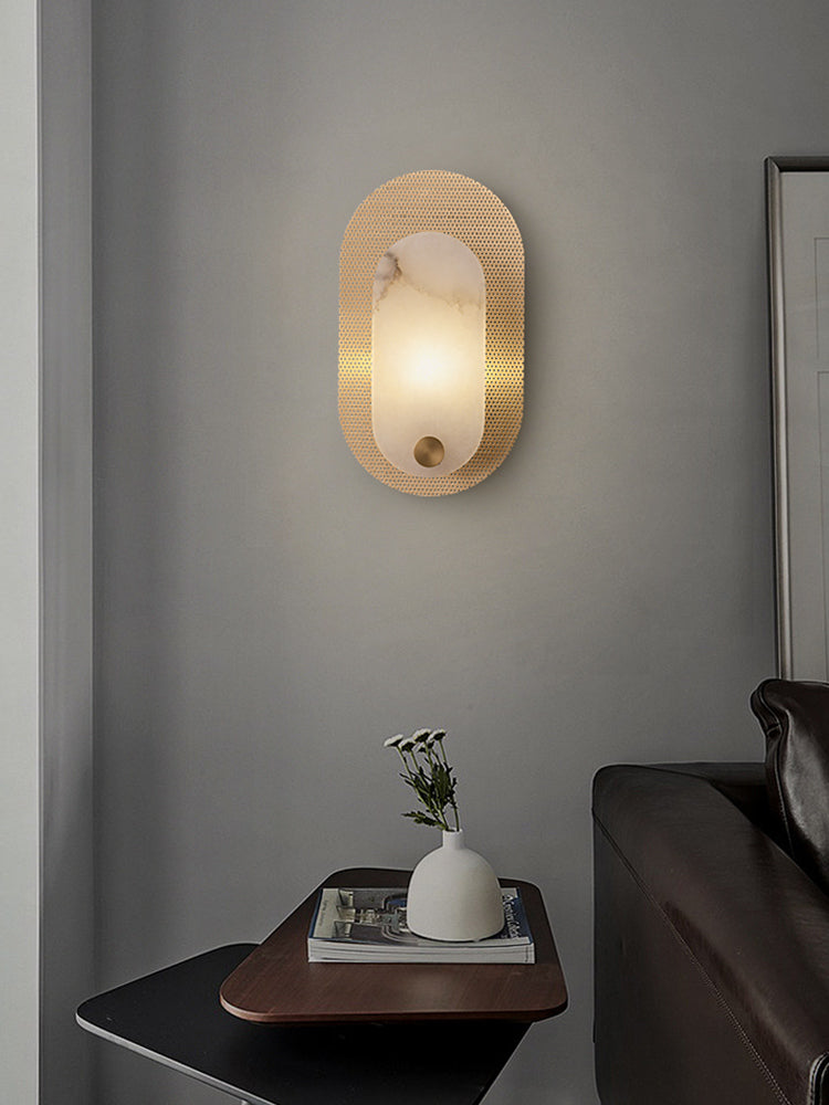 Modern Alabaster Oval Wall Sconce in Matte Gold above a side table