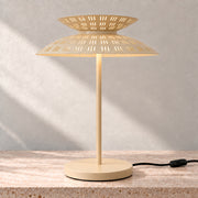 Cream Asterune table lamp with illuminated perforated upper and lower steel shades
