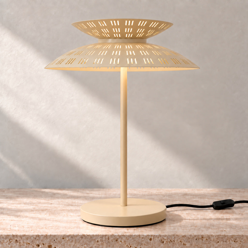 Cream Asterune table lamp with illuminated perforated upper and lower steel shades
