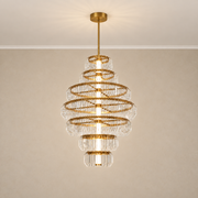 Arquelle Round Antique Brass Acrylic Tiered Chandelier centered hero · CDE 2026-09-24