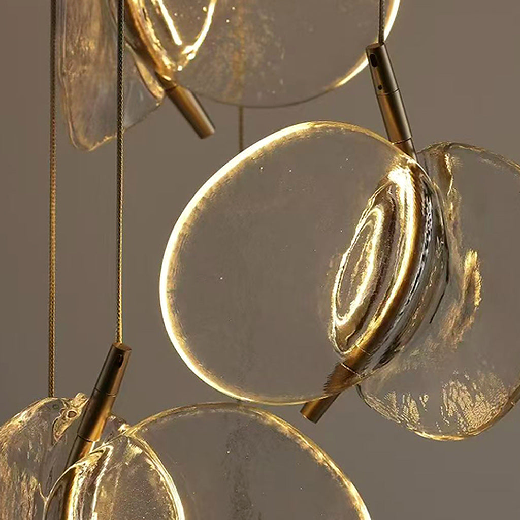 Close-up of illuminated hand-blown glass petals and metal suspension on Clear Blown Glass Petal Cascade Chandelier