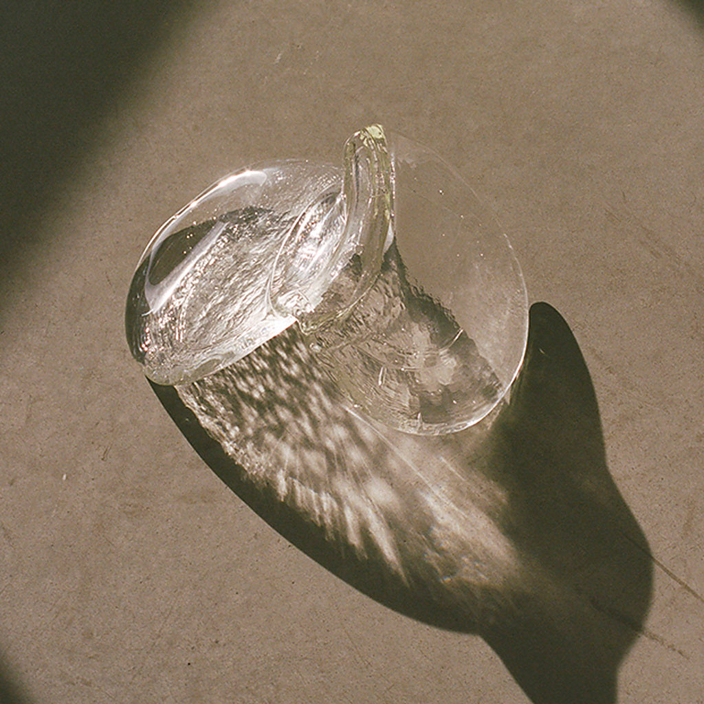 Hand-blown clear glass petal texture and light refraction detail