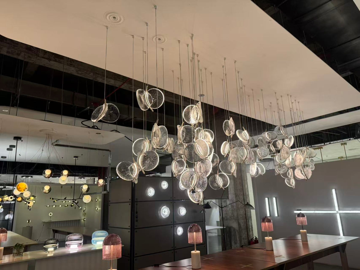 Clear Blown Glass Petal Cascade Chandelier photographed in the ARDEN LUME showroom, large cascading display