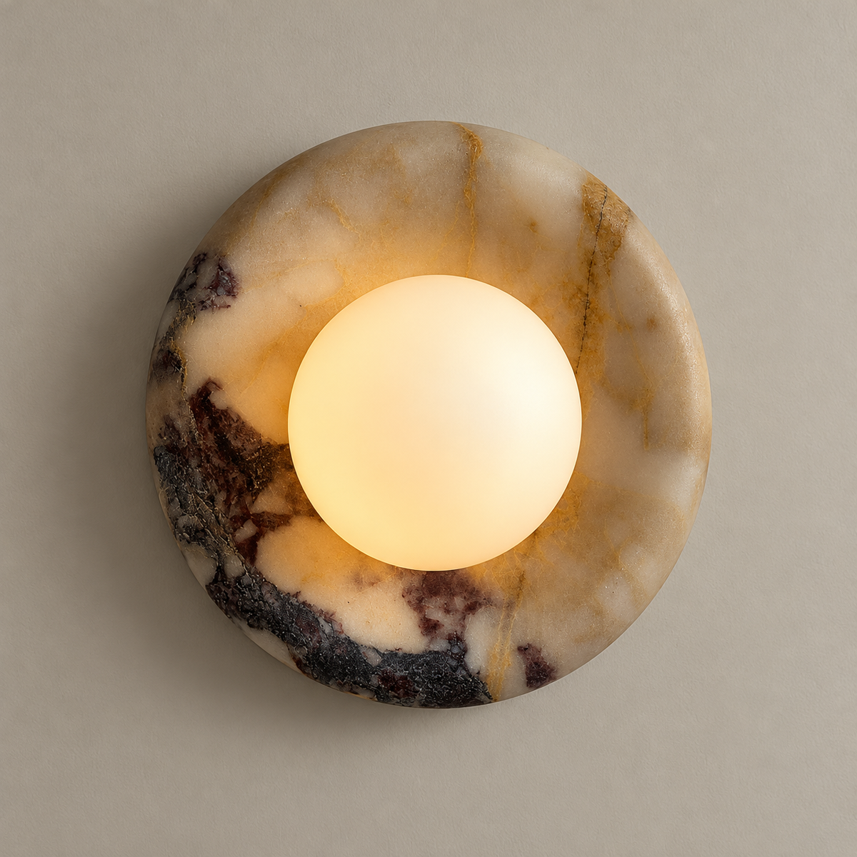 Orli Organic Modern Beige Marble Wall Sconce on a warm greige background