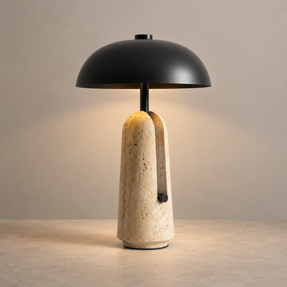 Pot Lid Marble Table Lamp on a warm greige background; Matte black cap and beige travertine