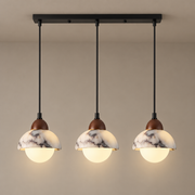 Polaris Mid-Century Marble Pendant Light on a warm greige background