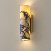 Purple Marble Cylinder Wall Sconce with Gold Backplate on a warm greige background; Purple veined marble cylinder with rectangular gold backplate