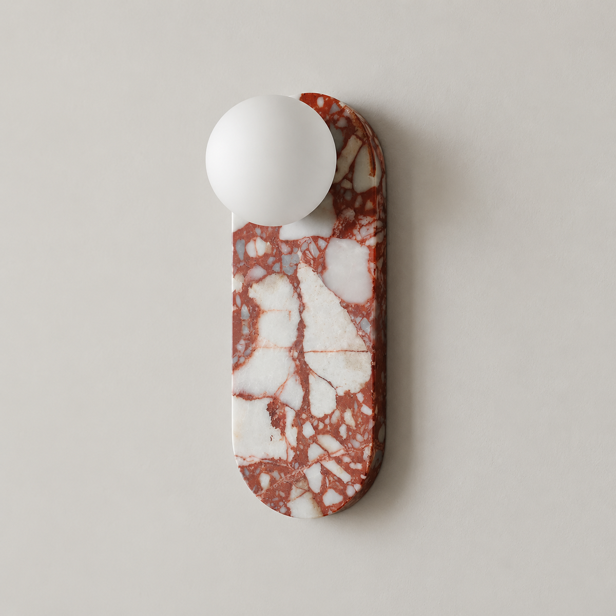 Lucie Organic Modern Marble Wall Sconce on a warm greige background; Representative red-white marble capsule, upper globe