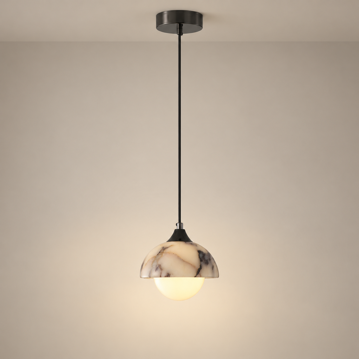 Artome Mid-Century Marble Pendant Light on a warm greige background; Single head; cream purple-veined marble dome; long black cord