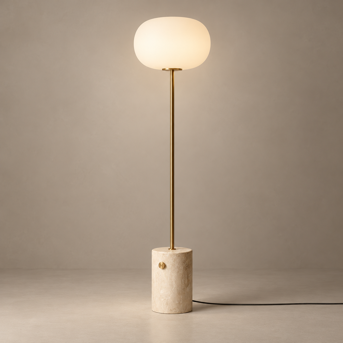 Mid-Century Marble and Glass Floor Lamp on a warm greige background; Beige travertine base; brushed gold stem; opal glass floor lamp