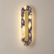 Marmo Marble LED Wall Sconce on a warm greige background; Purple-veined marble and natural brass capsule, 40 cm