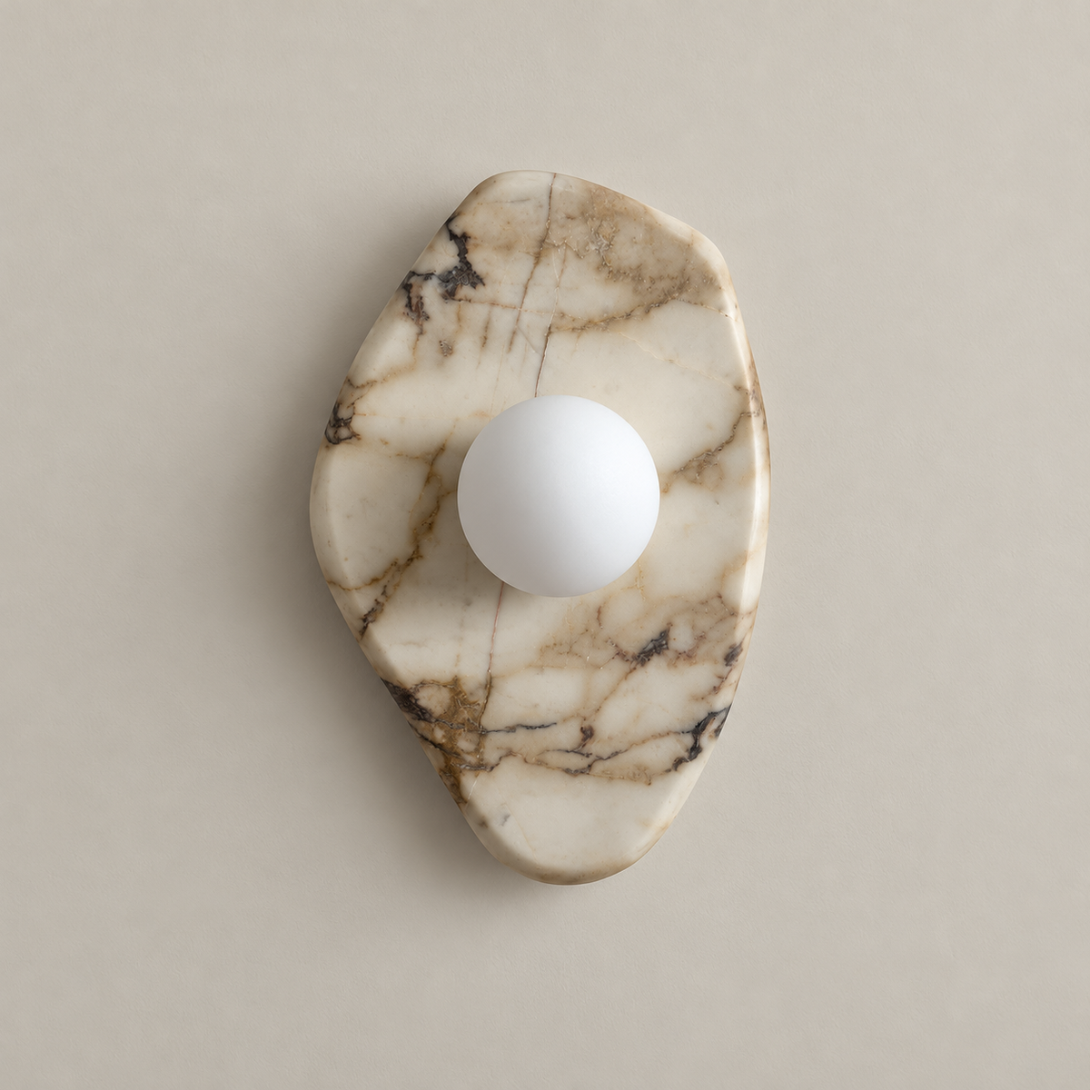 Organic Modern Textured Marble Wall Sconce on a warm greige background; White Marble A asymmetric organic shield plate; white opal globe