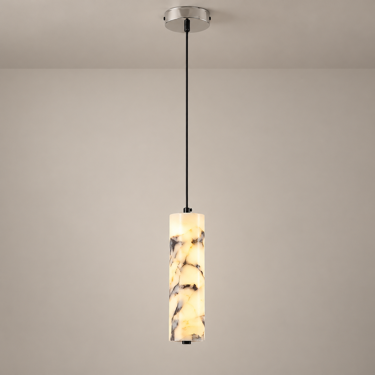 Opus Marble LED Pendant Light on a warm greige background; Creamy brecciated marble, silver canopy, single-head pendant