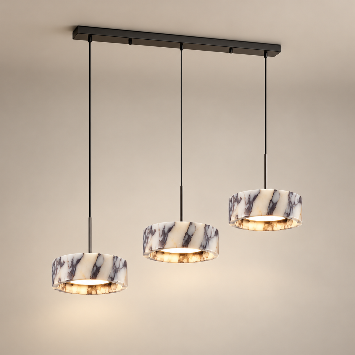 Elancourt Marble LED Pendant Light on a warm greige background; Elancourt THREE-head cream purple marble drums; black linear canopy