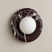 Orli Deep Purple Red Marble Globe Wall Sconce on a warm greige background; Deep Purple Red marble round globe, 20 cm
