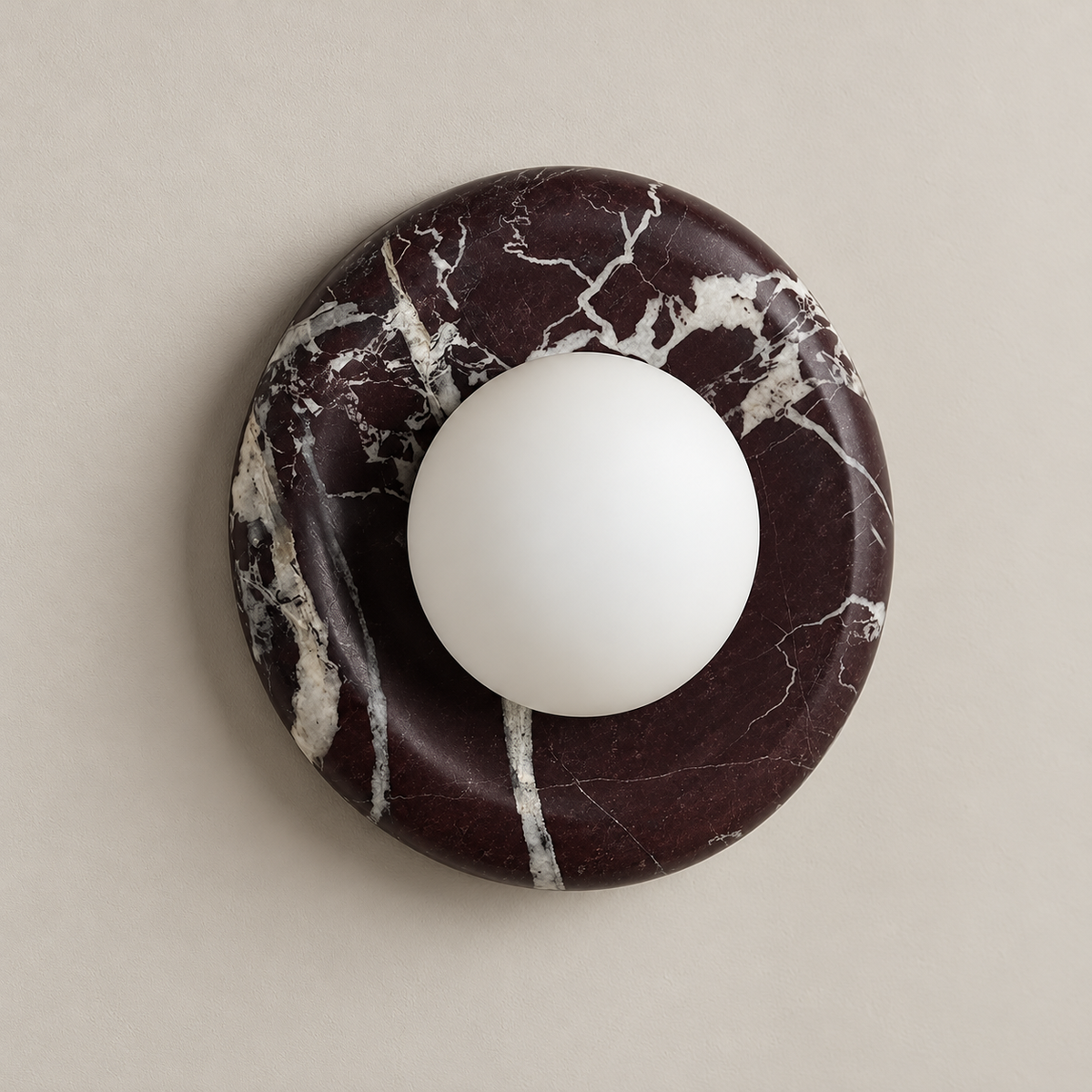 Orli Deep Purple Red Marble Globe Wall Sconce on a warm greige background; Deep Purple Red marble round globe, 20 cm