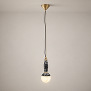 Lunar Art Deco Marble Pendant Light on a warm greige background; Lunar Black A single pendant, long cord