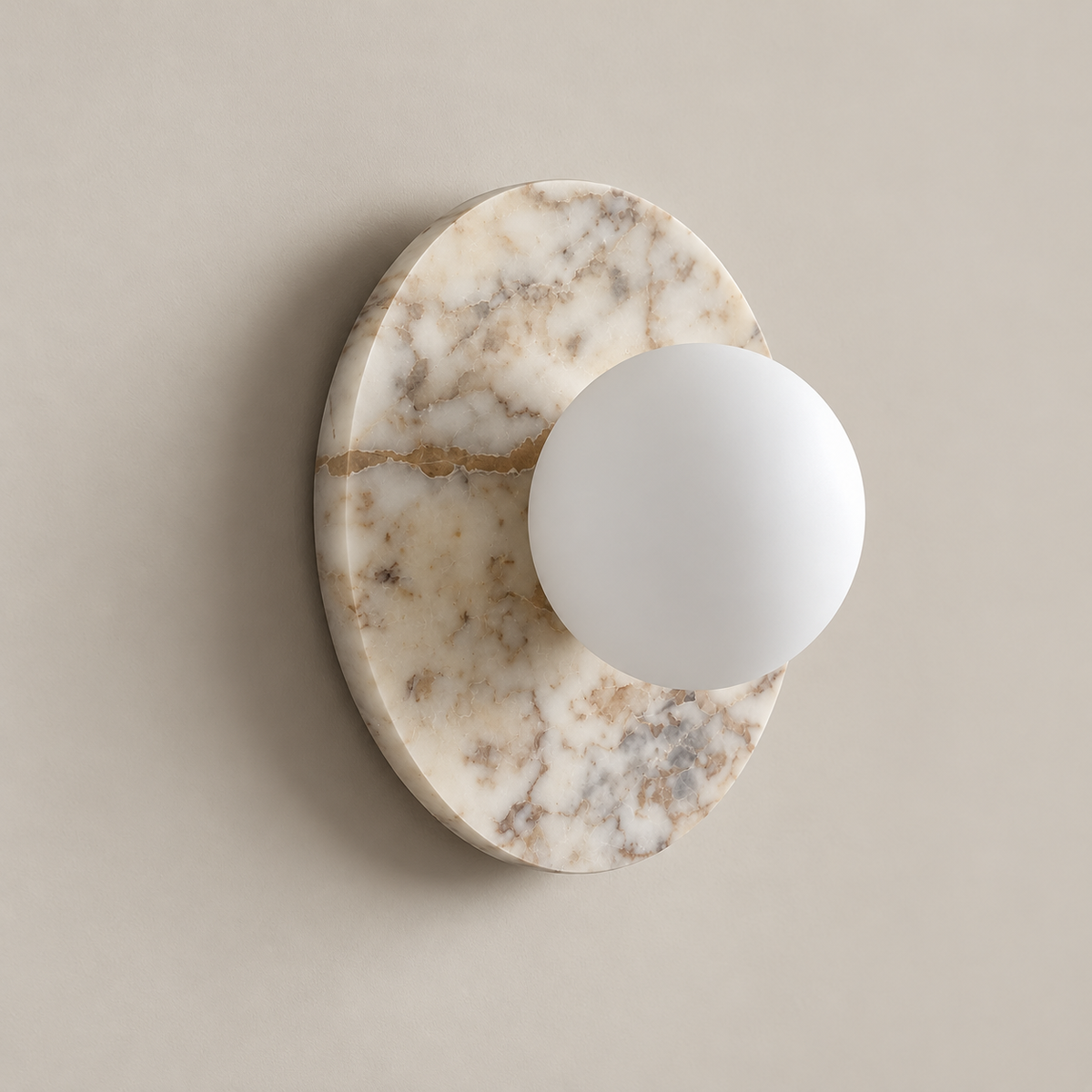 Leora Organic Modern Stone Wall Sconce on a warm greige background; Leora white marble and white glass globe