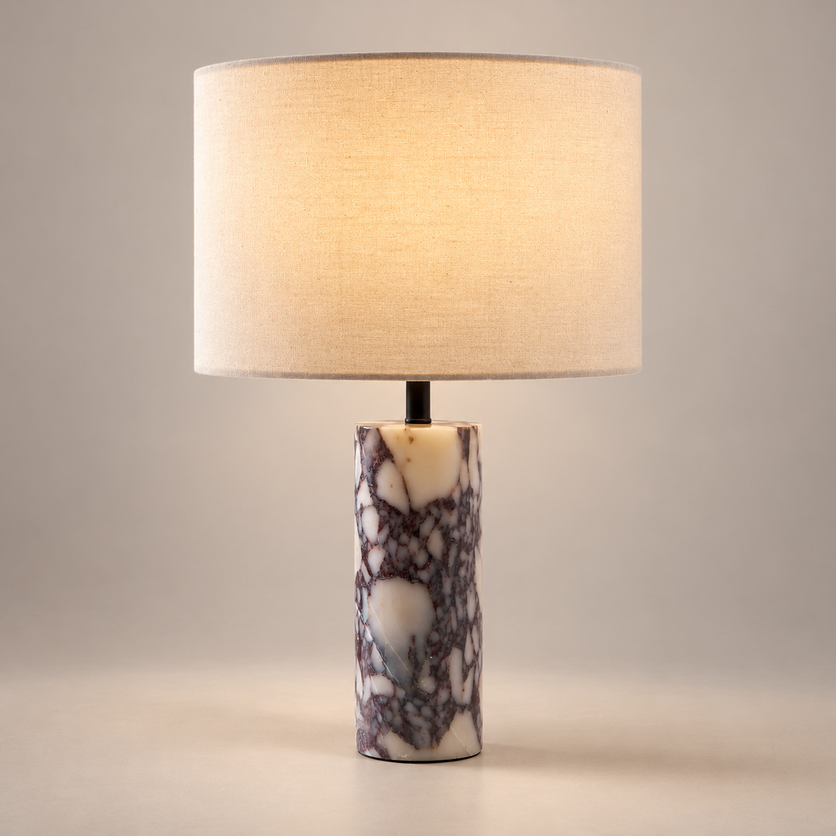 Brixton Marble Table Lamp on a warm greige background; Brixton purple breccia marble linen drum