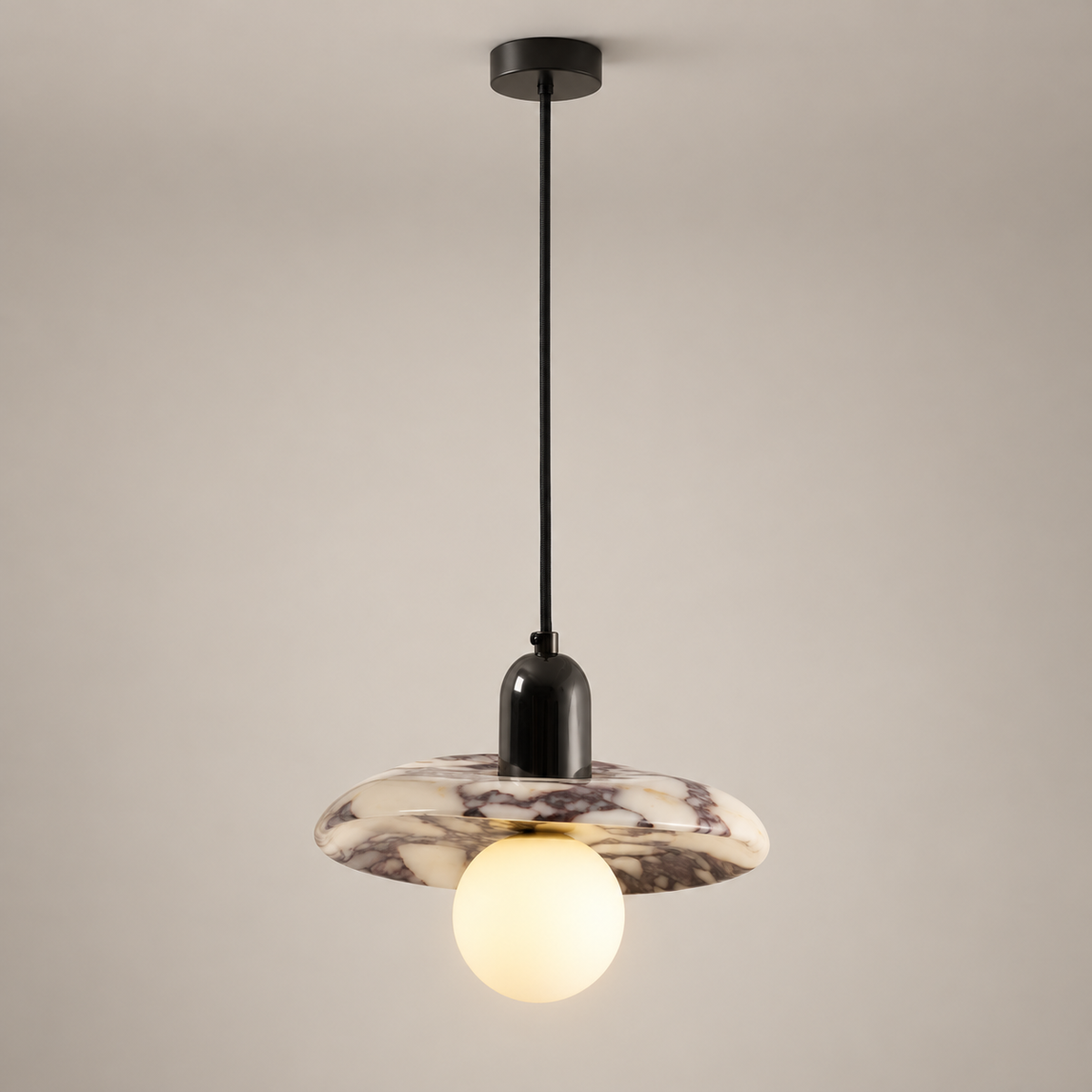 Lu Metal Pendant Light with Marble Shade on a warm greige background; Lu purple marble disc single pendant