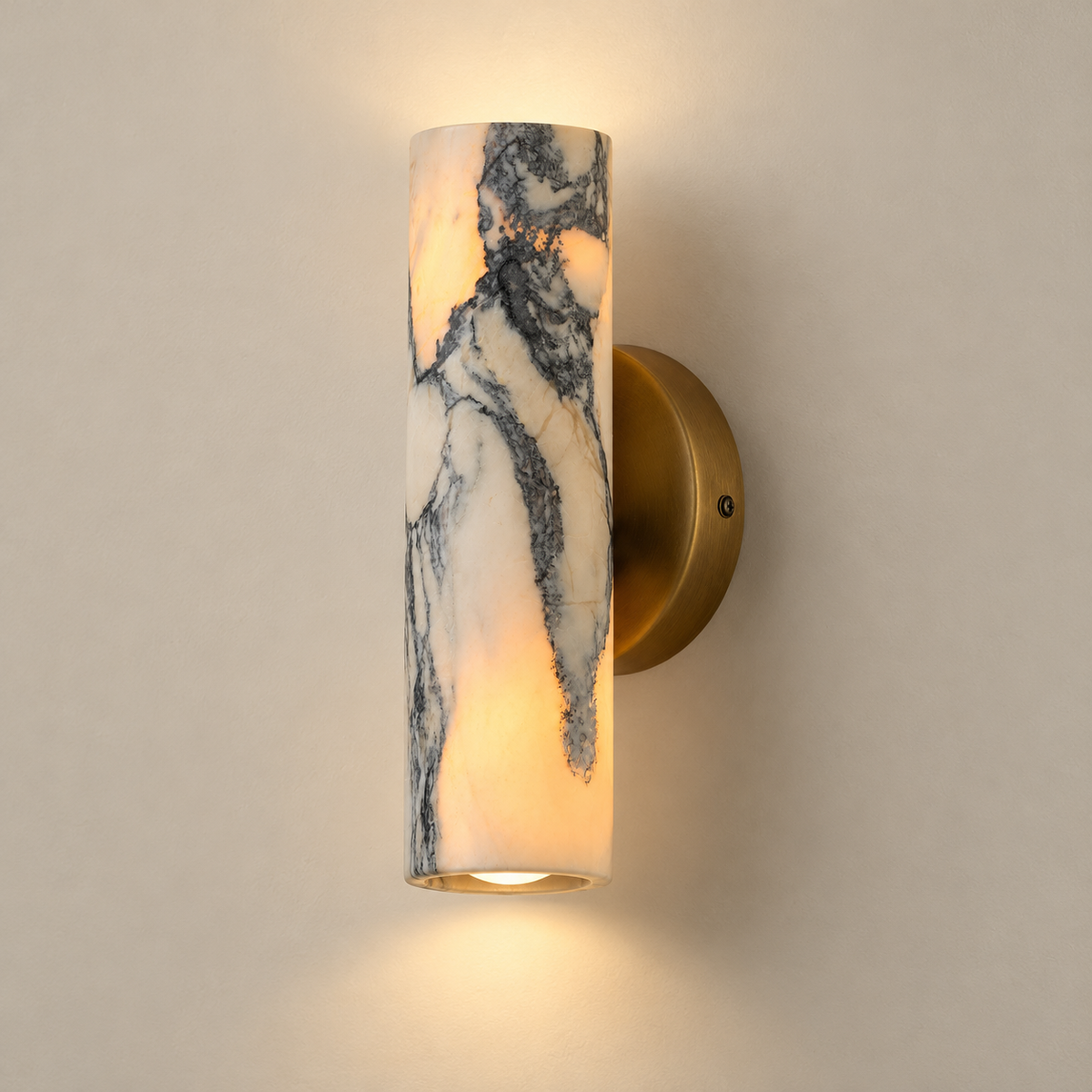 Calla Iron Wall Sconce with Marble Shade on a warm greige background; Vintage brass and cream grey veined marble, on