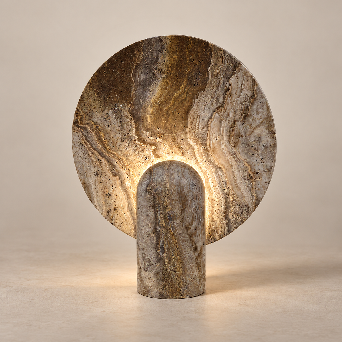 Surface Marble LED Table Lamp on a warm greige background; Brown banded marble disk, concealed LED on