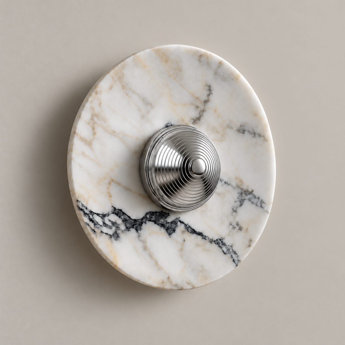 Marble disc wall sconce with raised mirror-polished silver cap and fine concentric grooves
