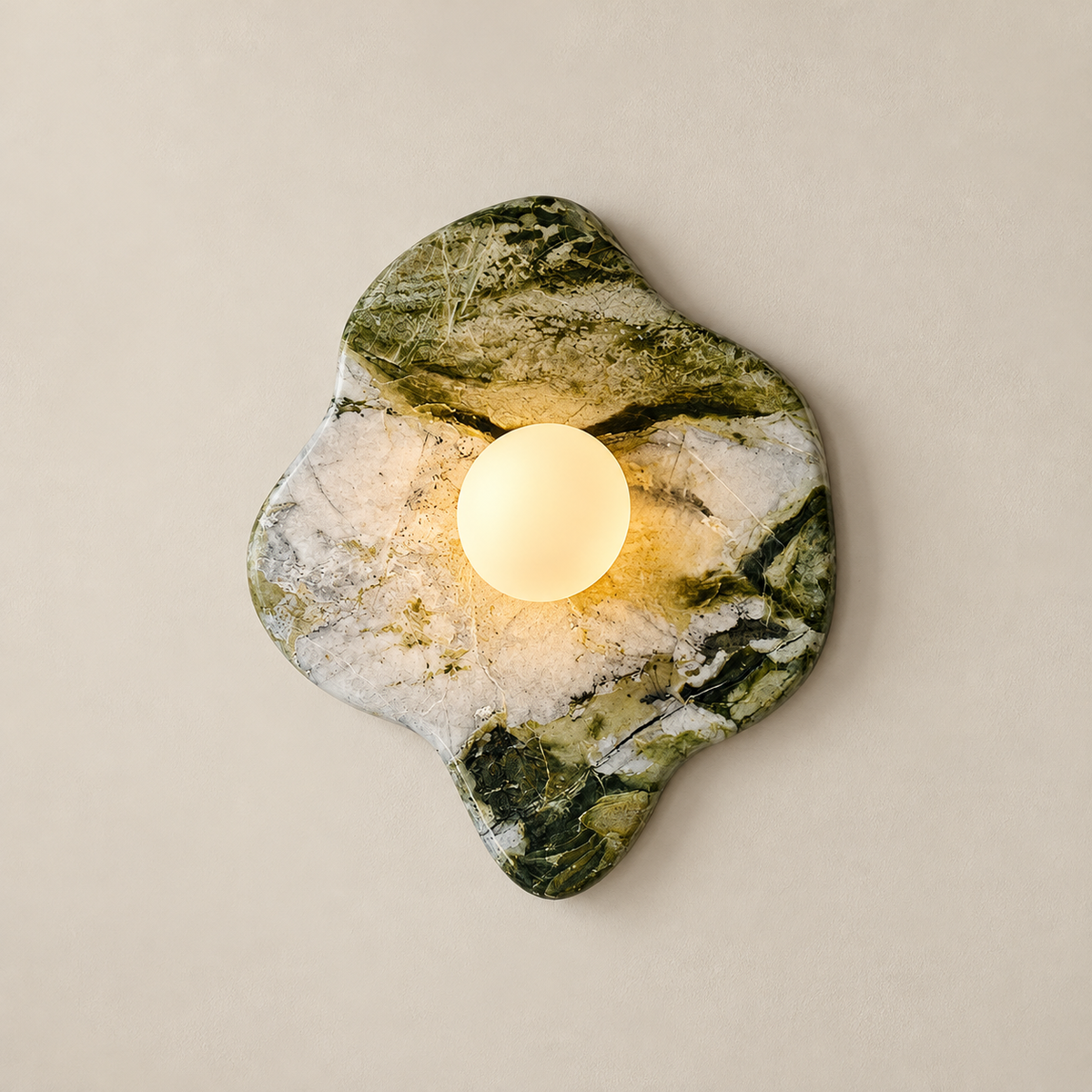 Emma Marble Globe Wall Sconce on a warm greige background; Model C, green and white marble, central opal globe