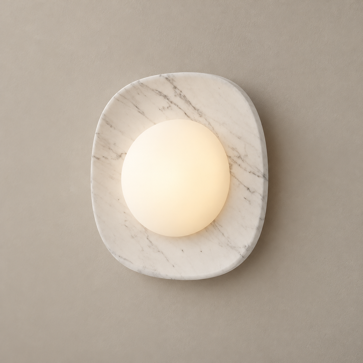 Naga Marble LED Wall Sconce on a warm greige background; White grey marble rounded square with opal glass dome