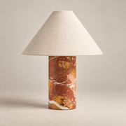 Chez Minimalist Marble Table Lamp on a warm greige background; Red brown breccia marble cylinder and ivory cone shade