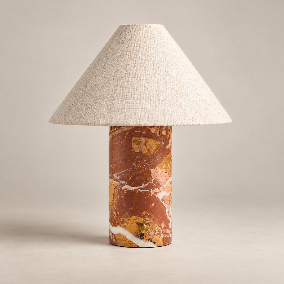 Chez Minimalist Marble Table Lamp on a warm greige background; Red brown breccia marble cylinder and ivory cone shade