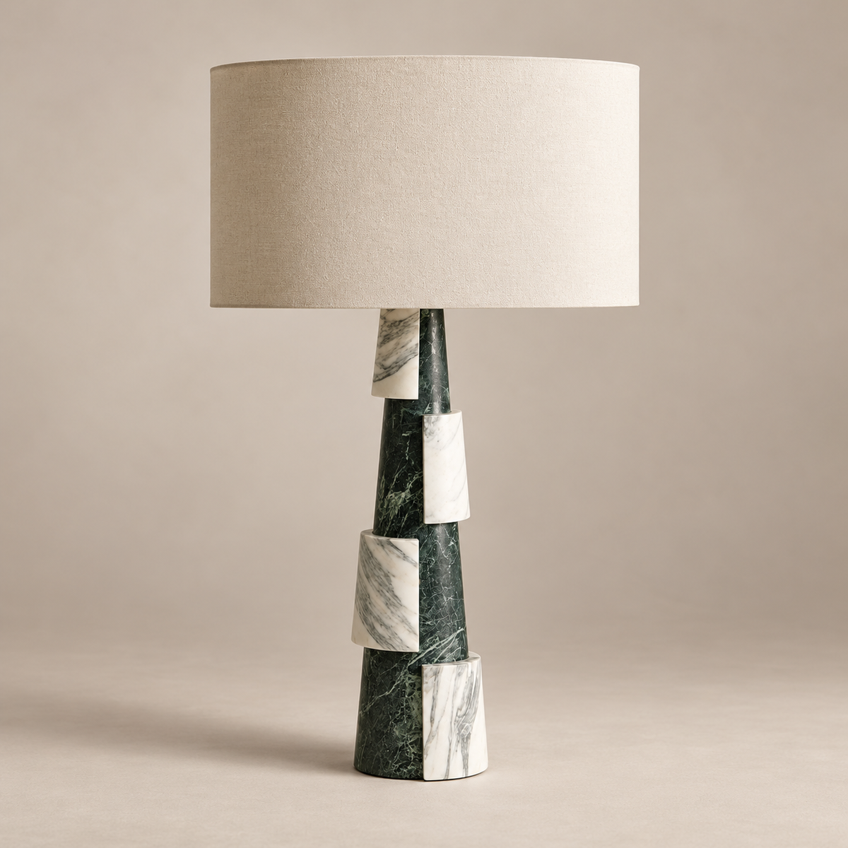 Misha Marble Table Lamp with Fabric Shade on a warm greige background; Green and white stacked marble base table lamp