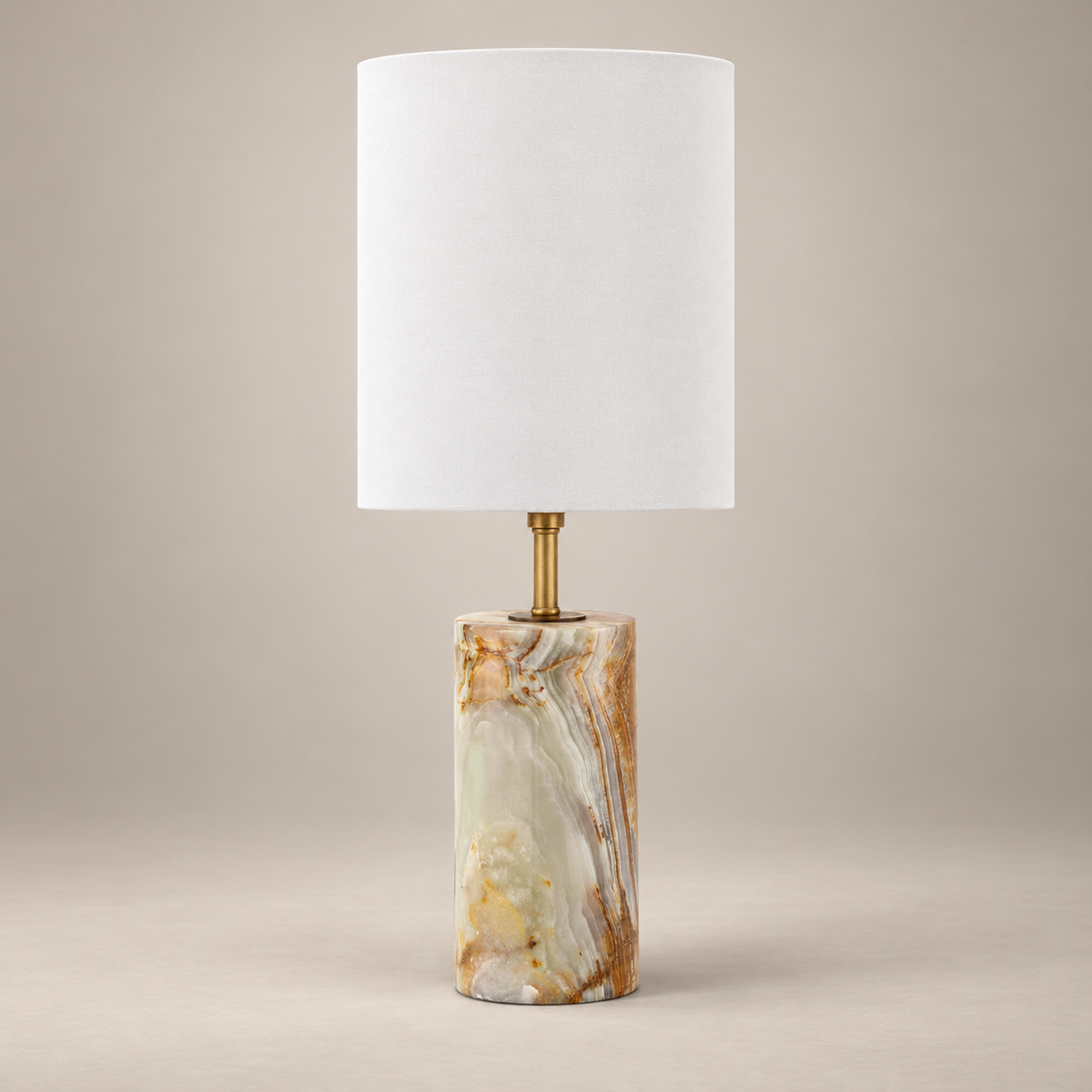 Maricopa Traditional Stone Table Lamp on a warm greige background; Cyan onyx cylinder base with tall white drum shade