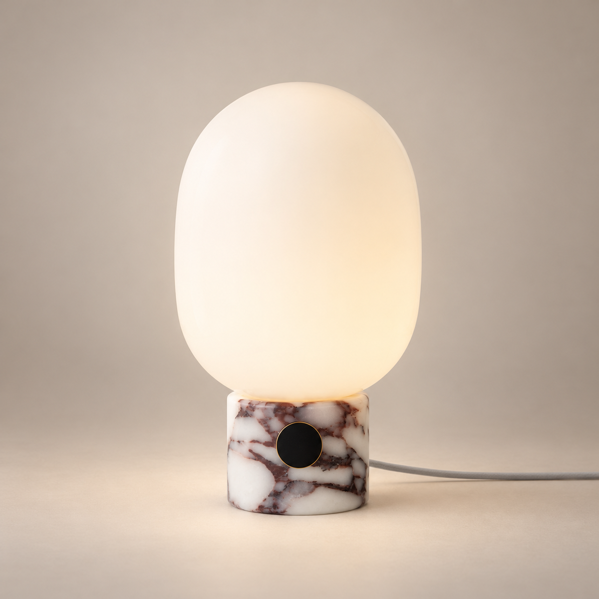 Mid-Century Marble Audio Table Lamp on a warm greige background; Purple marble cylinder with oval opal glass table lamp
