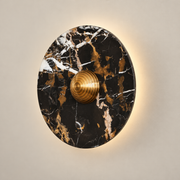Lucie Black Gold Marble LED Wall Sconce on a warm greige background