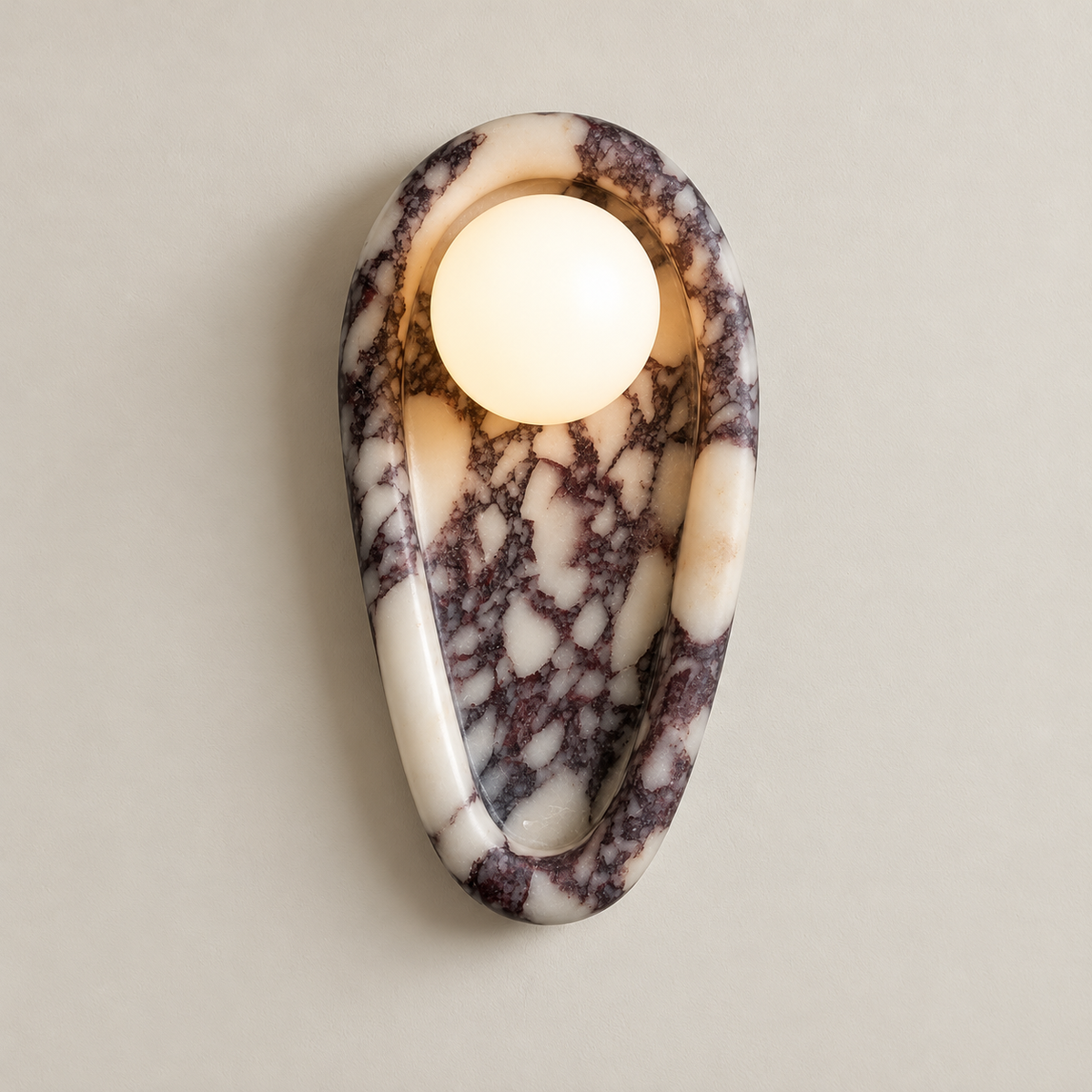 Nidus Organic Modern Marble Wall Sconce on a warm greige background